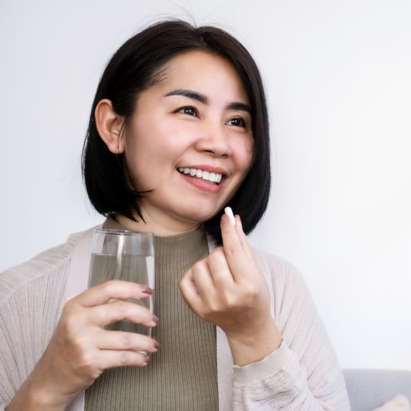 A woman massaging Ashwagandha oil into her scalp