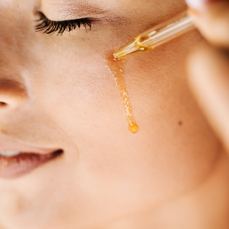 Applying serum for radiant skin